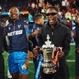 Nigerian Afrobeats star Mr Eazi celebrates Crystal Palace FA Cup win with Eddie Nketiah.