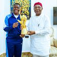 Super Falcons goalkeeper Chiamaka Nnadozie presents her CAF Award to the Imo State Governor and First Lady.