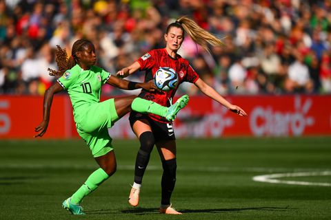 Jordyn Huitema of Canada fights for the ball with Super Falcons player Christy Ucheibe