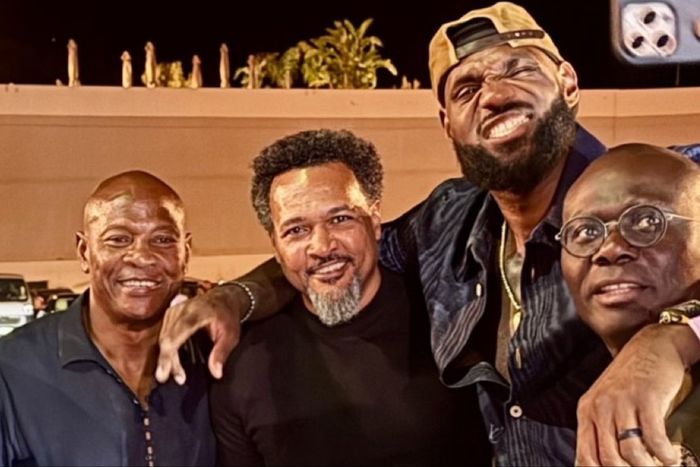 Lagos State Governor Babajide Sanwo-Olu takes out his phone for a selfie with NBA icon LeBron James in Paris.