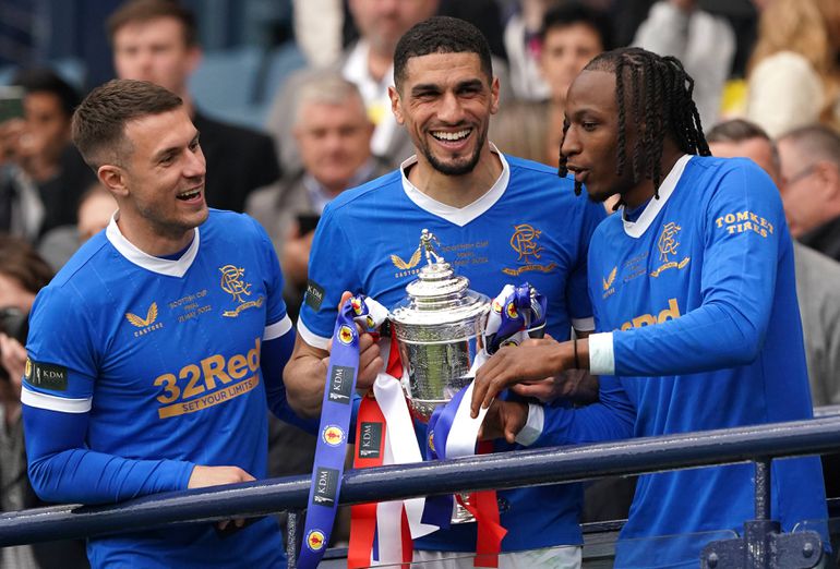 Rangers v Heart of Midlothian - Scottish Cup - Final - Hampden Park Rangers Aaron Ramsey, Leon Balogun and Joe Aribo (left-right) celebrate with the trophy following the Scottish Cup final at Hampden Park, Glasgow. Picture date: Saturday May 21, 2022.