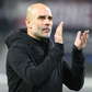 Pep Guardiola applauds the visiting fans after the draw against Leipzig