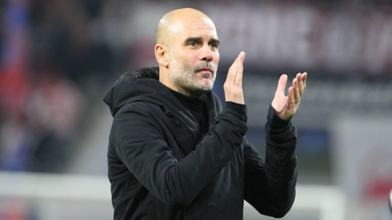 Pep Guardiola applauds the visiting fans after the draw against Leipzig