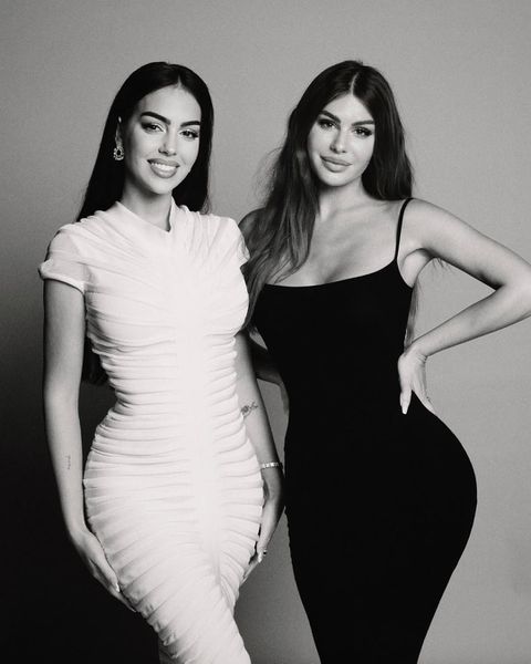 Georgina Rodriguez and Nima Benati pose for a photo on set