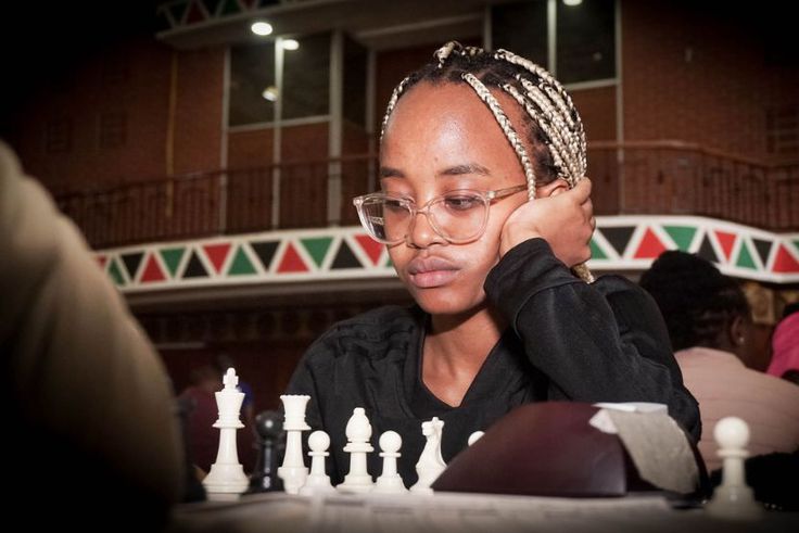 A young chess player in action.