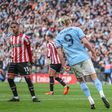 Riyad Mahrez celebrates after scoring for Manchester City against Sheffield
