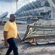 Nigeria's Minister of Youths and Sports Development, Sunday Dare during an inspection tour of the collapsed National Stadium floodlight mast on Friday