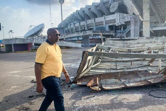 Nigeria's Minister of Youths and Sports Development, Sunday Dare during an inspection tour of the collapsed National Stadium floodlight mast on Friday