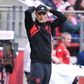 Thomas Tuchel reacting with his hands behind his head on the touchline.