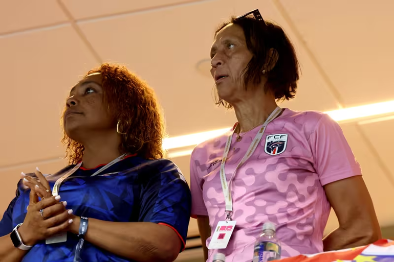 Vozinha's mother watches on from the stands.