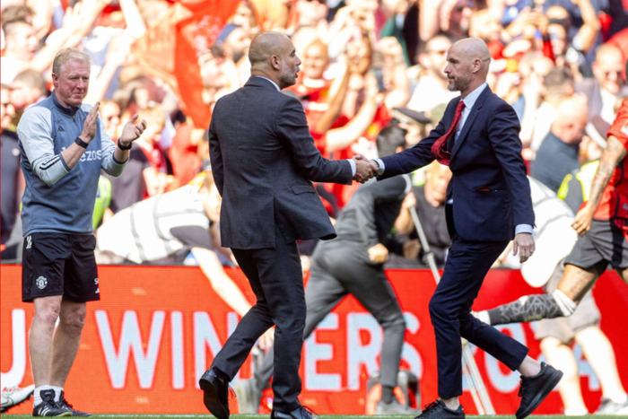 Manchester City s manager Josep Pep Guardiola (L) shakes hands with Manchester United s manager Erik ten Hag after the FA Cup Final between Manchester City FC and Manchester United FC at Wembley Stadium. (Photo by David Rawcliffe/Propaganda)