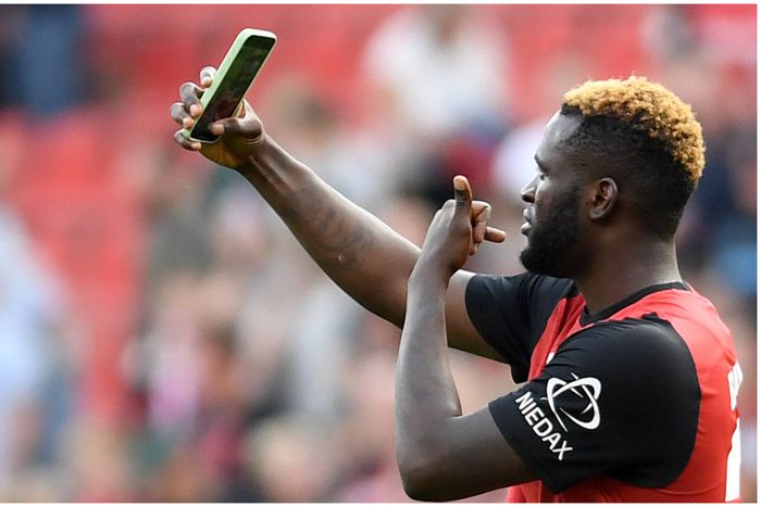Victor Boniface with an iconic celebrate at the BayArena.
