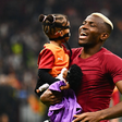 Victor Osimhen celebrating with his daughter after record setting Bodo/Glimt triumph || Image credit: Imago