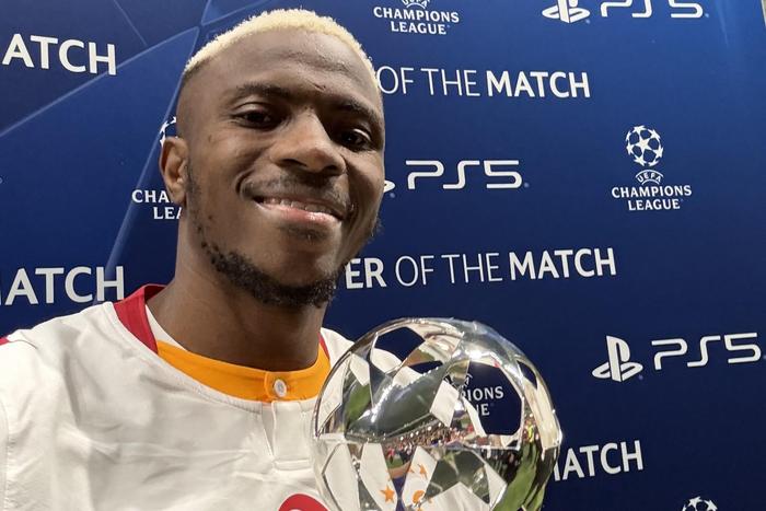 Victor Osimhen with the player of the match award from UEFA.