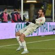 Milan keep pace with leaders Inter, Napoli stunned by Spezia