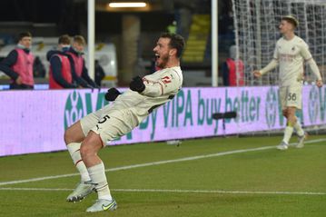 Milan keep pace with leaders Inter, Napoli stunned by Spezia