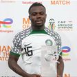 Super Eagles star Moses Simon celebrates the AFCON 2023 Man of the Match award.