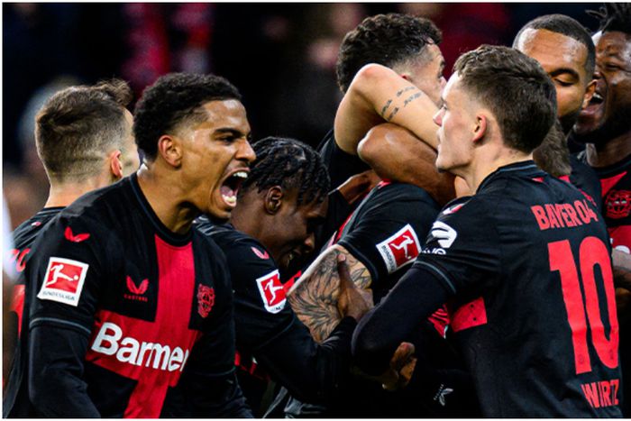 Bayer Leverkusen stars celebrate a history night.