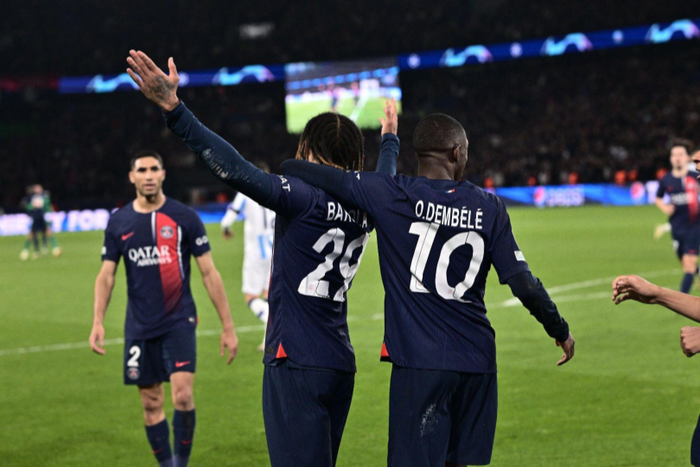 Bradley Barcola of Paris Saint-Germain celebrates with Ousmane Dembele and Kylian Mbappe after scoring a goal during the UEFA Champions League 2023/24 round of 16 first leg match between Paris Saint-Germain and Real Sociedad || Image credit: iMAGO