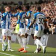 Kaoru Mitoma celebratees goal with Brighton teammates.