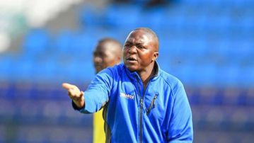 Ulinzi Starlets coach Joseph Mwanzia salutes troops after march past Thika Queens