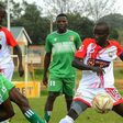 Kakamega Homeboyz Moses Mudavadi sandwiched by Vihiga Bullets players