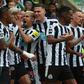 Newcastle United players celebrate a goal vs Tottenham Hotspur.