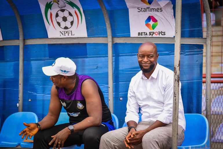 Ex-Enyimba boss Finidi George (right) and assistant, Yemi Olanrewaju (left) during an NPFL match.