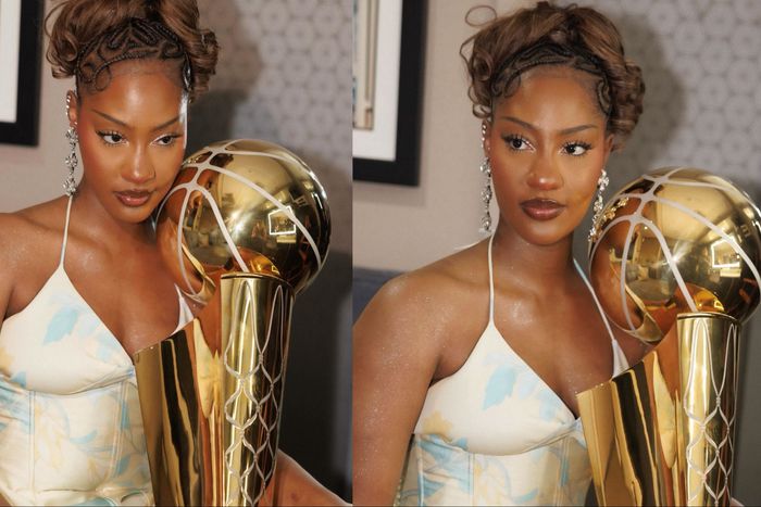 Nigerian Afrobeats star Tems poses with NBA Larry O’Brien Championship Trophy.