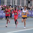 American runner Connor Mantz battles Cybrian Kotut and Alphonce Simbu at Boston Marathon.