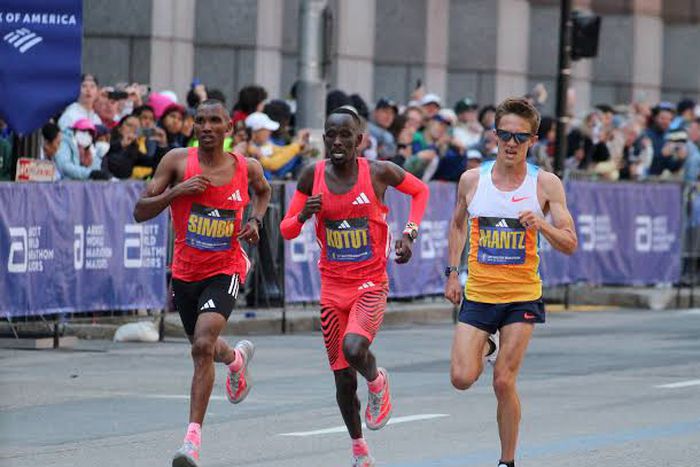 American runner Connor Mantz battles Cybrian Kotut and Alphonce Simbu at Boston Marathon.