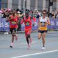 American runner Connor Mantz battles Cybrian Kotut and Alphonce Simbu at Boston Marathon.