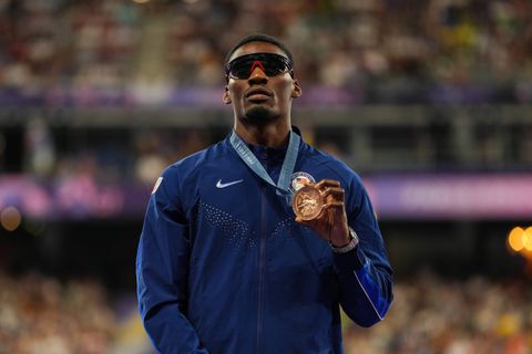 Why does Fred Kerley wear sunglasses during races?