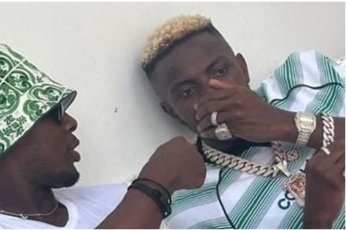 Ighalo speaks to Osimhen during their hang out.