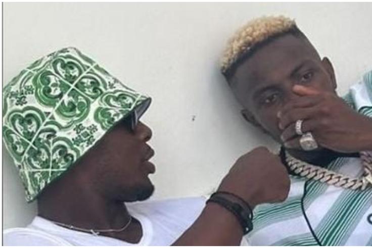 Ighalo speaks to Osimhen during their hang out.