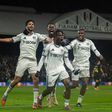 Chukwueze, Iwobi and his teammates celebrate the late winner. (Photo Credit: Imago)