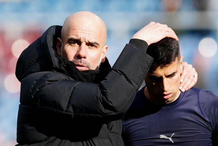 Manchester City manager Pep Guardiola (left) and Joao Cancelo || Image credit: Imago