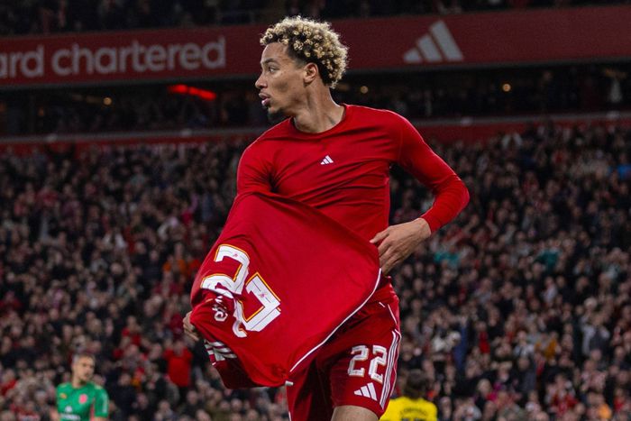 Hugo Ekitike takes his shirt off as he celebrates after scoring the second goal during the Football League Cup 3rd Round match between Liverpool FC and Southampton FC at Anfield.