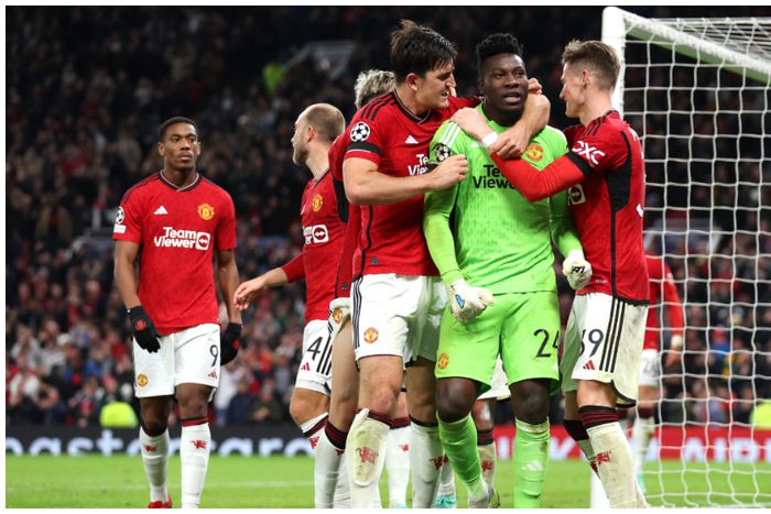 Harry Maguire and Andre Onana celebrate the win.
