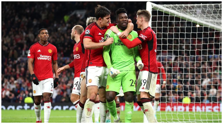 Harry Maguire and Andre Onana celebrate the win.