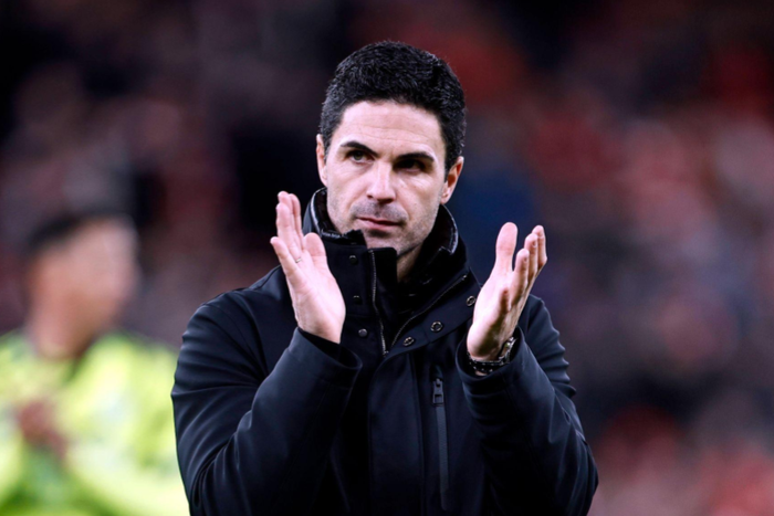 Arsenal manager Mikel Arteta applauds the travelling Arsenal fans after they came away from the game with a 1-1 draw, at Anfield || Image credit: IMAGO