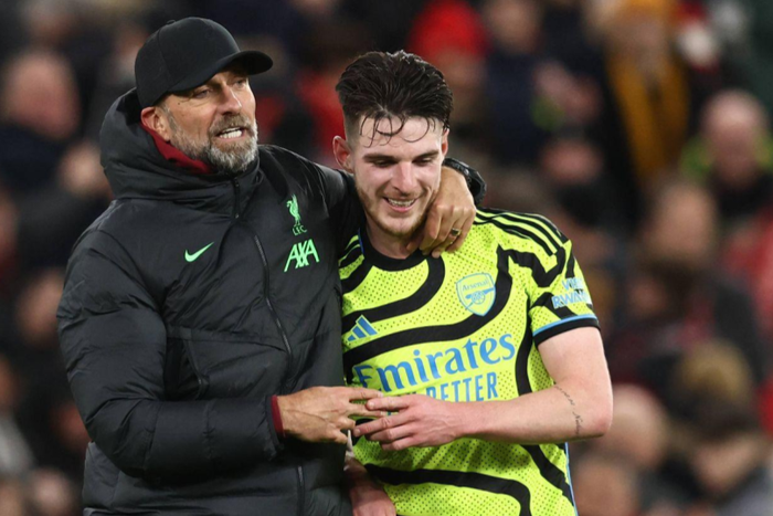 Jurgen Klopp manager of Liverpool hugs Declan Rice of Arsenal during the Premier League match at Anfield, Liverpool || Picture credit: Darren Staples / Sportimage