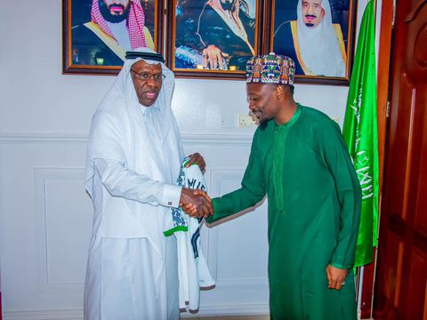 In Kano, Super Eagles captain Ahmed Musa gifts a Nigerian jersey to the Saudi Arabia Consul.