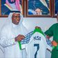 In Kano, Super Eagles captain Ahmed Musa gifts a Nigerian jersey to the Saudi Arabia Consul.