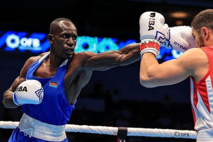 John Waweru (in Blue) in action