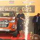 Eliud Kipchoge (L) posing for a photo with the Eliud Kipchoge 1:59 Limited Special D-Max Edition.