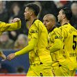 Dortmund players congratulate Nmecha after his goal.