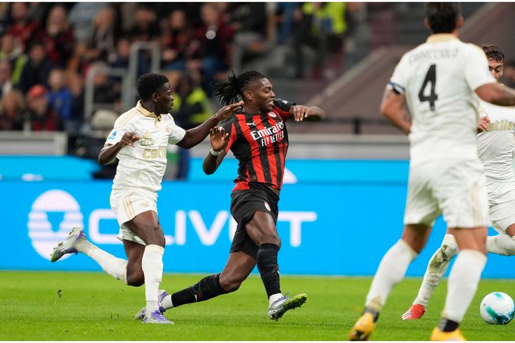 Ebenezer Akinsanmiro (left), a young Nigerian midfielder, marks Rafael Leao of AC Milan  on the pitch.