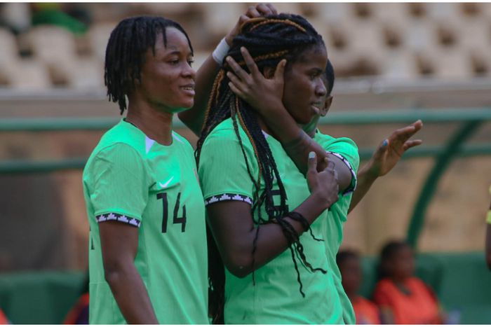 Esther Okonkwo and her Super Falcons mates celebrate the winner.