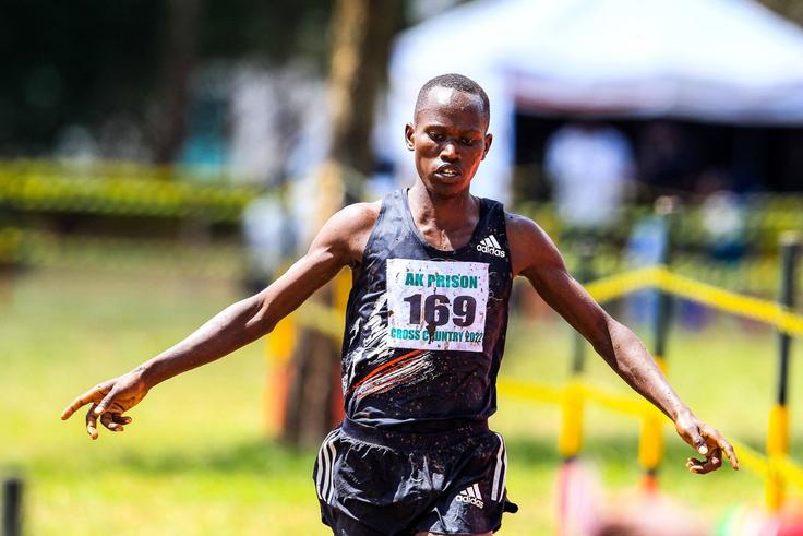 Isaiah Lasoi celebrates while crossing 10km senior men on December 17th during Athletics Kenya Prisons National Cross Country championship at Prisons Staff Training College.